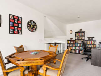 This versatile bonus room offers a perfect blend of entertainment and productivity.