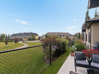Enjoy outdoor living in this charming property featuring a private patio with comfortable seating and a barbecue grill.