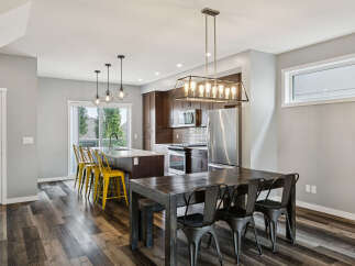 Experience modern living in this open-concept kitchen and dining area, perfect for entertaining.