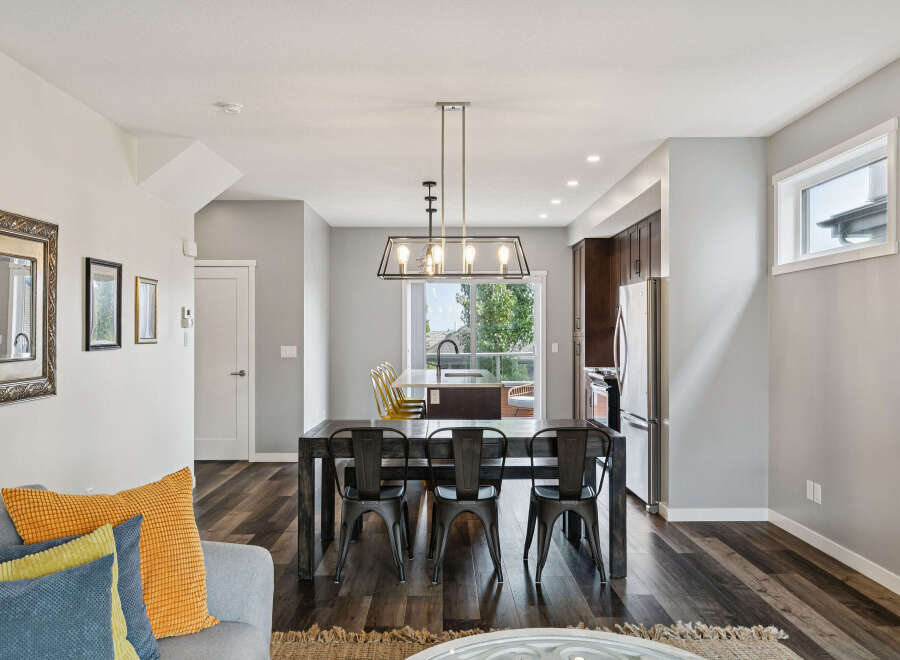 Experience modern living in this open-concept dining and kitchen area, perfect for entertaining.