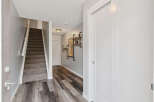Step into this inviting entryway featuring a carpeted staircase leading to the upper level.