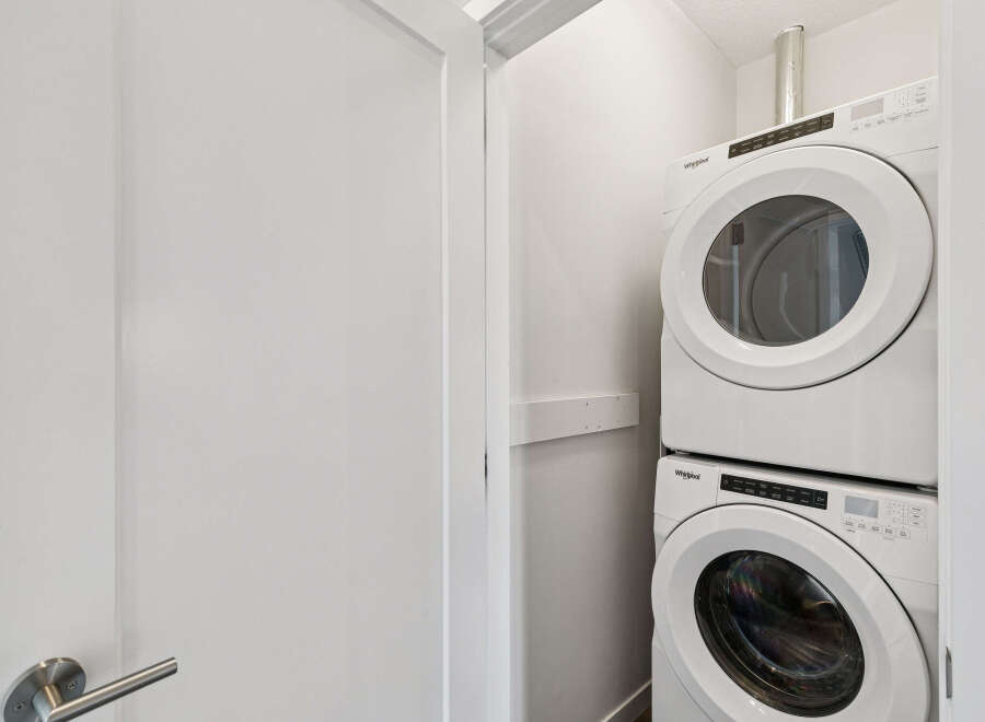 Discover the convenience of in-unit laundry with this stacked Whirlpool washer and dryer set.