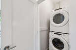 Discover the convenience of in-unit laundry with this stacked Whirlpool washer and dryer set.