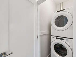 Discover the convenience of in-unit laundry with this stacked Whirlpool washer and dryer set.