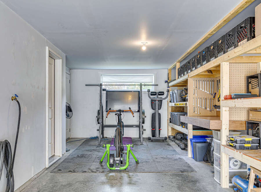 Transform this versatile garage space into your personal home gym or a functional workshop.