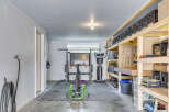Transform this versatile garage space into your personal home gym or a functional workshop.