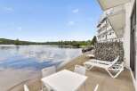 Enjoy lakeside living with this stunning property featuring a private beach area and direct water access.
