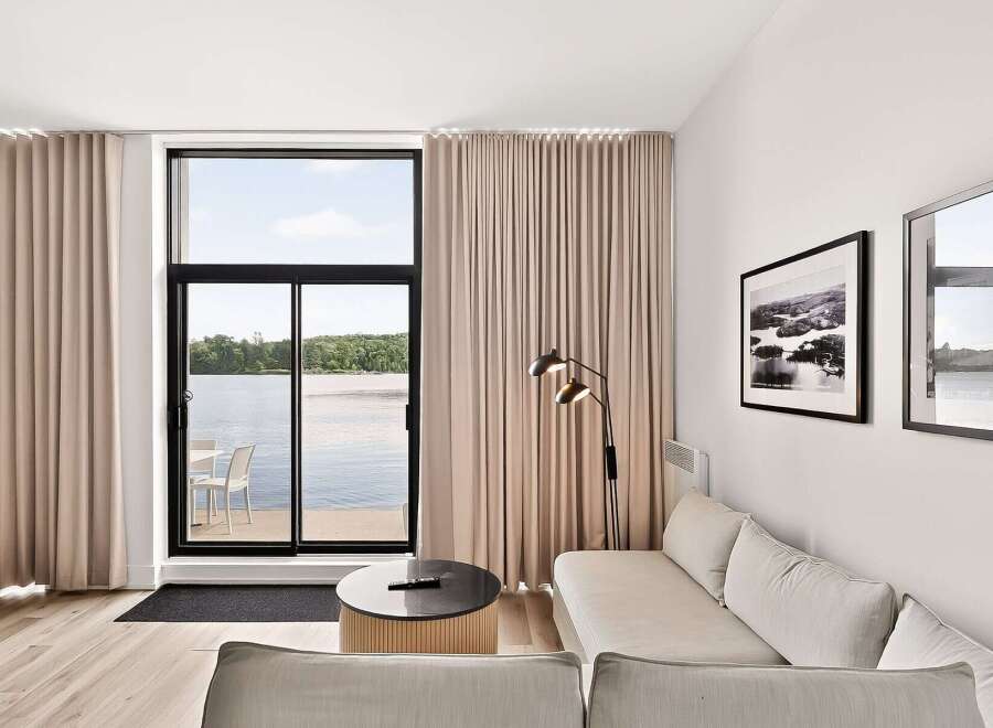 Experience modern living with stunning lake views from this beautifully appointed living space.