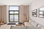 Experience modern living with stunning lake views from this beautifully appointed living space.