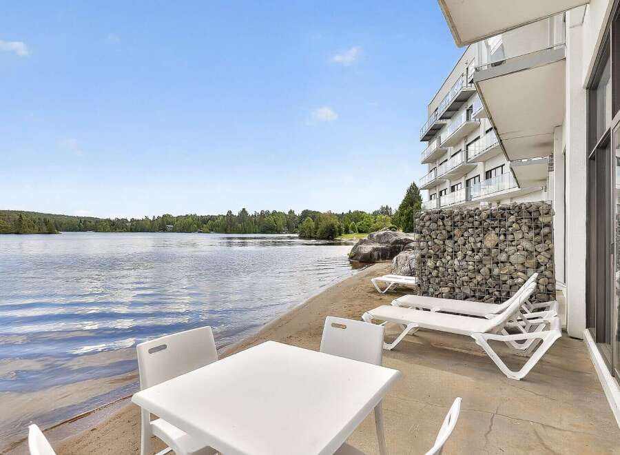 Enjoy lakeside living with this stunning property featuring a private beach and modern amenities.