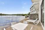 Enjoy lakeside living with this stunning property featuring a private beach and modern amenities.