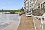 Enjoy lakeside living with this stunning property featuring a private beach and direct water access.