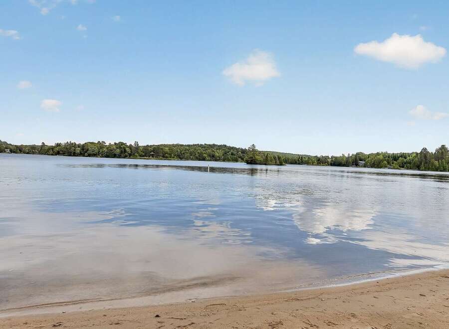 Experience serene lakefront living with this stunning property.