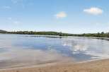Experience serene lakefront living with this stunning property.