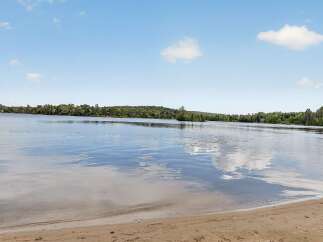 Experience serene lakefront living with this stunning property.