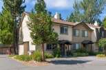 Discover this charming townhouse nestled amongst mature trees, offering a serene and private living experience.
