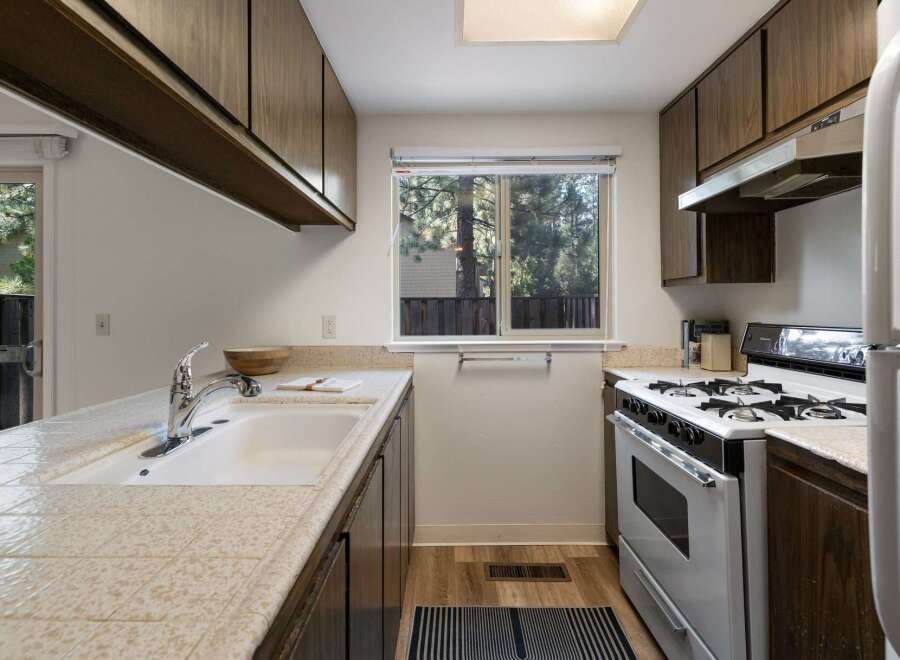 This charming kitchen features ample cabinet space and a functional layout.