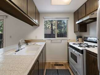 This charming kitchen features ample cabinet space and a functional layout.