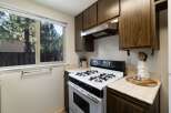This charming kitchen features a gas range and ample cabinet space, perfect for home chefs.