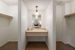 Discover a functional dressing area with ample closet space on either side, perfect for organizing your wardrobe.