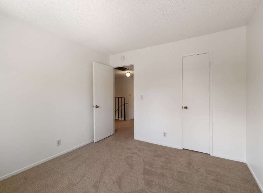 Step into this inviting room featuring plush carpeting and clean white walls, creating a serene atmosphere.