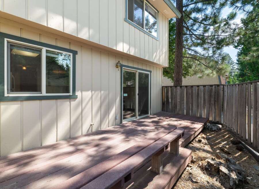 Enjoy outdoor living on this spacious wooden deck, perfect for entertaining or relaxing in the fresh air.