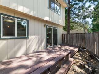 Enjoy outdoor living on this spacious wooden deck, perfect for entertaining or relaxing in the fresh air.