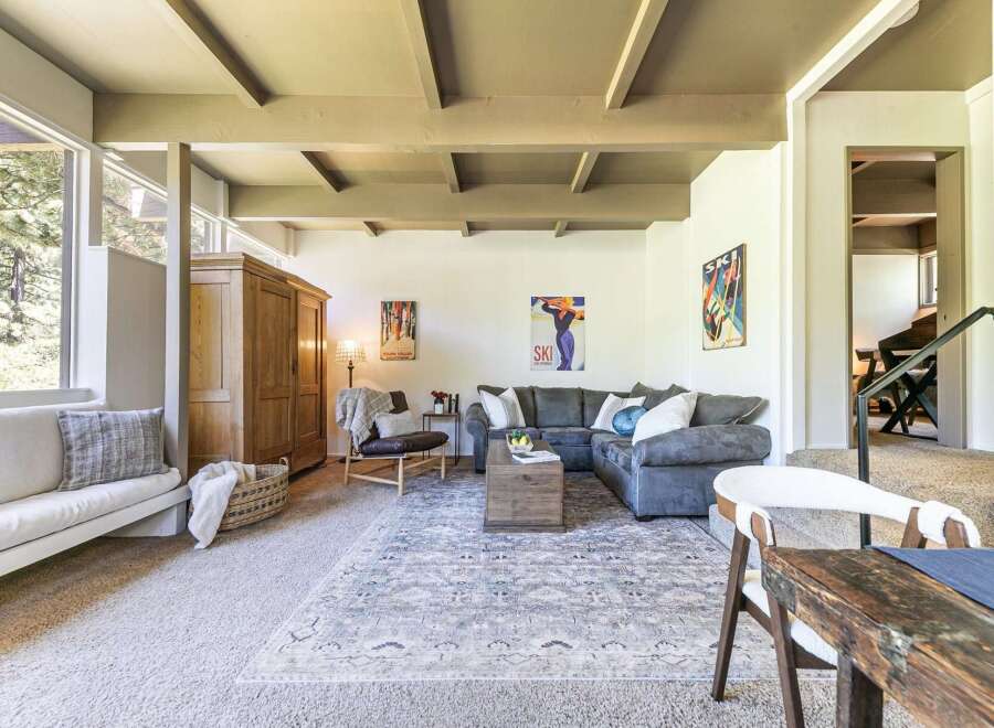 Experience cozy living in this inviting living room, featuring a plush sectional sofa perfect for relaxation.