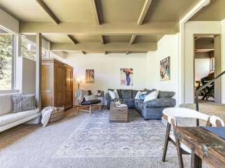 Experience cozy living in this inviting living room, featuring a plush sectional sofa perfect for relaxation.