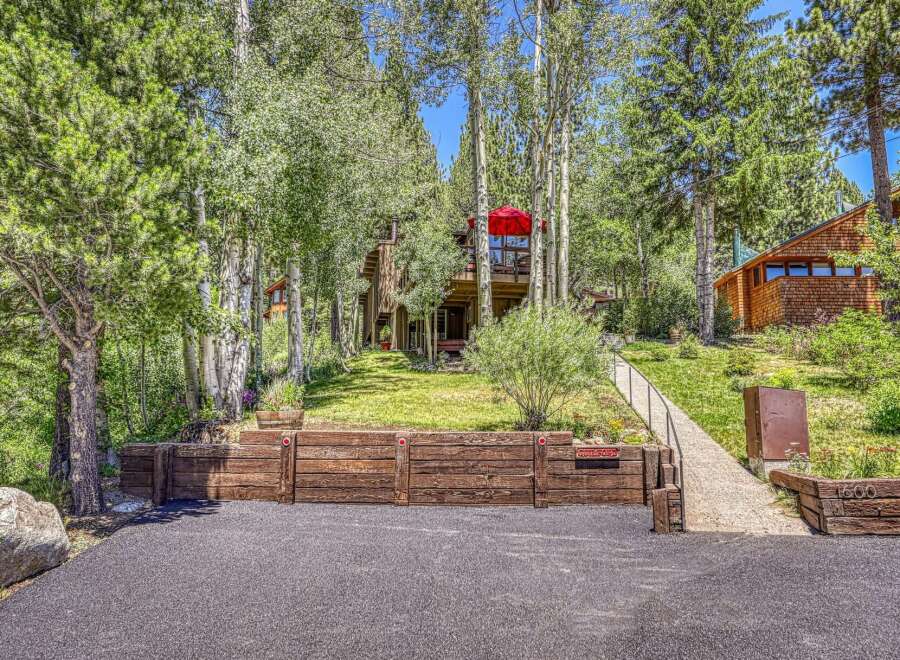 Nestled amongst mature trees, this charming mountain home offers a serene retreat.