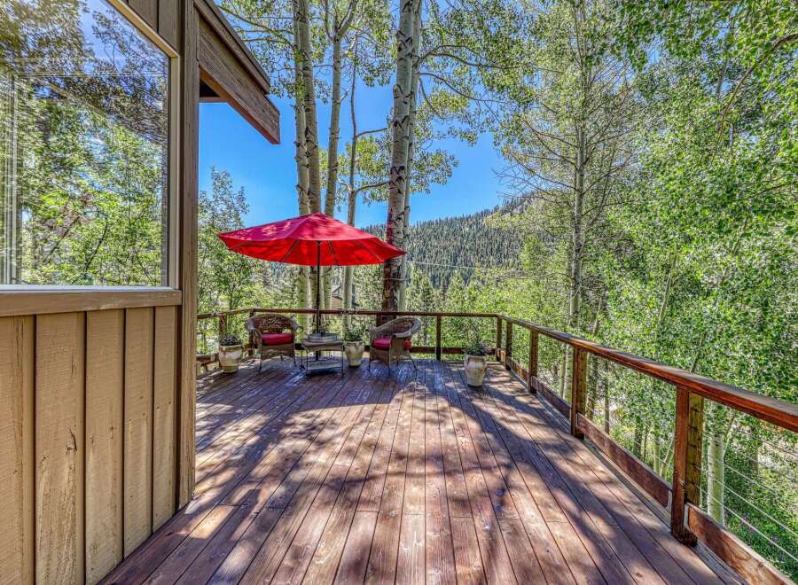 Enjoy the serene mountain views from this charming deck, perfect for outdoor relaxation and entertaining.