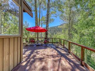 Enjoy the serene mountain views from this charming deck, perfect for outdoor relaxation and entertaining.