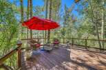 Enjoy the serene mountain views from this charming deck, perfect for outdoor relaxation.