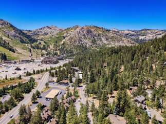 Discover this stunning mountain retreat nestled amidst towering pine trees and offering breathtaking views of the surrounding peaks.