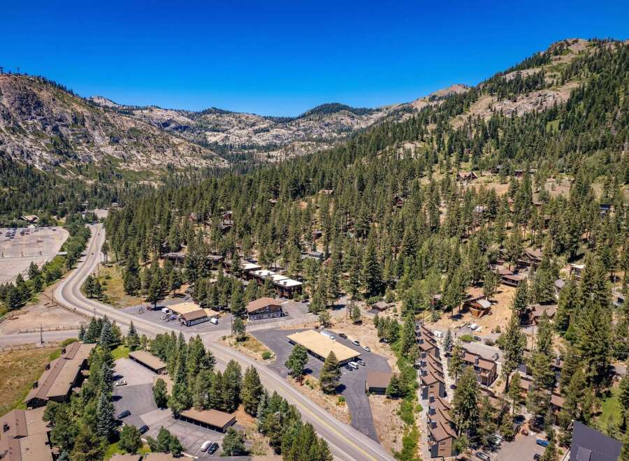 Discover this stunning mountain property nestled amidst a lush pine forest, offering breathtaking views and a serene escape.