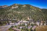 Nestled amidst a dense forest and rolling hills, this property offers a serene mountain retreat.