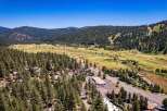 Discover this stunning property nestled amidst a lush pine forest, offering breathtaking mountain and valley views.