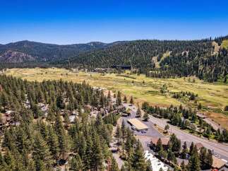 Discover this stunning property nestled amidst a lush pine forest, offering breathtaking mountain and valley views.