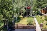 Nestled amongst mature trees, this charming home offers a serene mountain retreat.