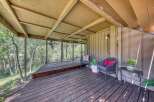 Enjoy the serene mountain views from this charming covered deck, perfect for relaxing or entertaining.