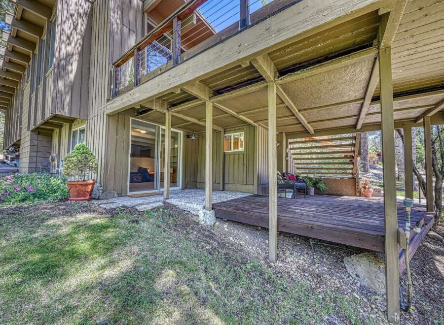 Enjoy outdoor living with this charming property featuring a spacious deck perfect for entertaining or relaxing amidst nature.