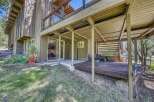 Enjoy outdoor living with this charming property featuring a spacious deck perfect for entertaining or relaxing amidst nature.