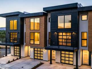 Experience modern luxury in these stunning townhomes featuring sleek architectural design and premium finishes.