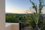 Experience breathtaking sunset views over the city skyline and rolling hills from this elevated vantage point.