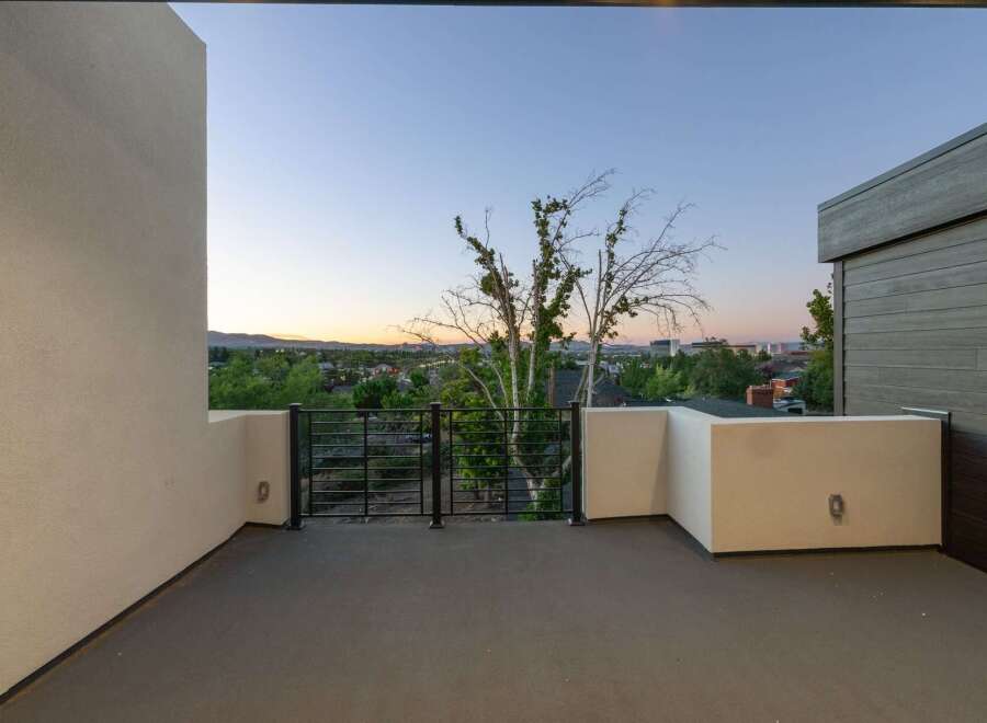 Enjoy breathtaking sunset views from this modern balcony, perfect for unwinding after a long day.
