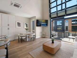 Experience modern living in this stunning apartment featuring a spacious open-concept living area with a sleek dining set and a comfortable seating arrangement.