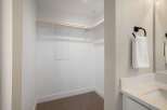 Step into this spacious walk-in closet, ready for your personal touch.