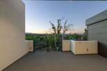 Enjoy breathtaking sunset views from this modern balcony, perfect for unwinding after a long day.