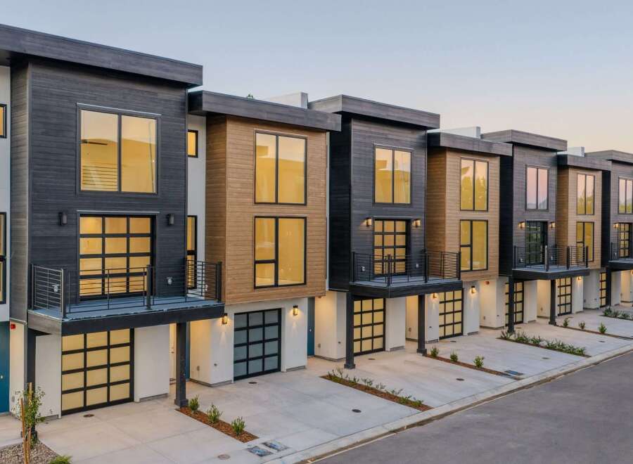 Discover modern living in these stunning townhomes featuring sleek architectural design and premium finishes.