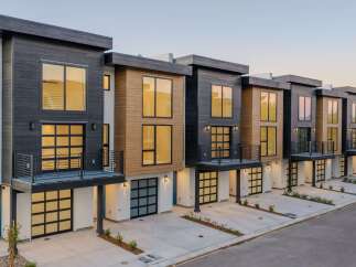 Discover modern living in these stunning townhomes featuring sleek architectural design and premium finishes.